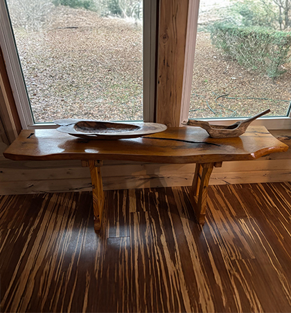 Small wooden table against a window